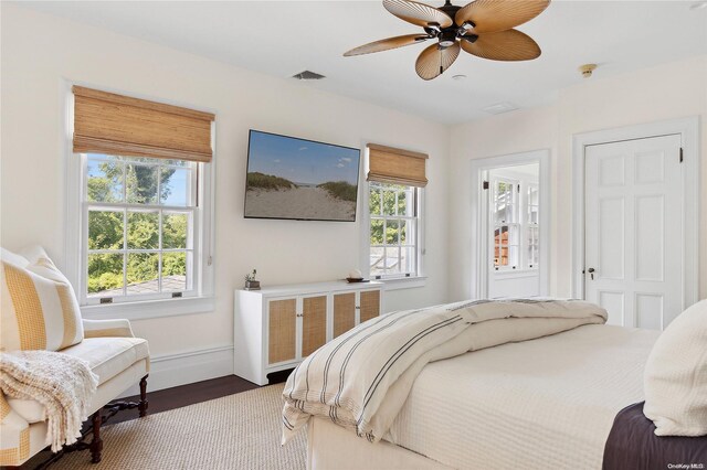 bedroom featuring ceiling fan and dark wood-type flooring