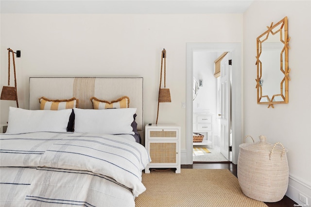 bedroom with hardwood / wood-style floors