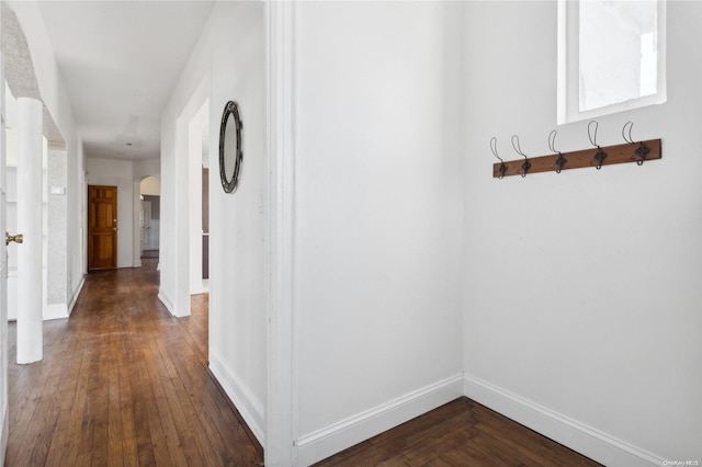 hallway with dark wood-type flooring