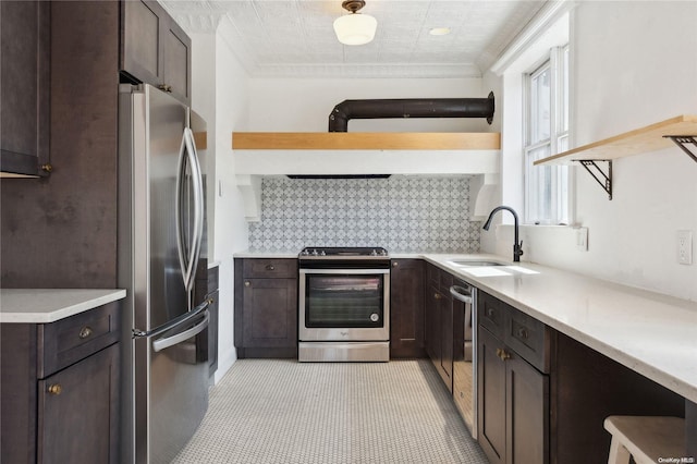 kitchen featuring sink, dark brown cabinetry, and stainless steel appliances