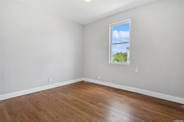 empty room featuring hardwood / wood-style floors