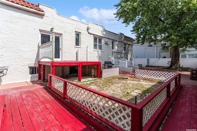 wooden deck featuring area for grilling