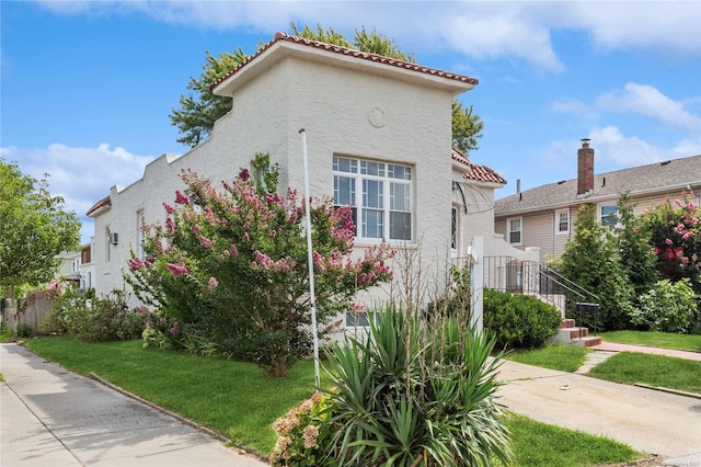 view of home's exterior with a yard