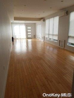 empty room featuring wood-type flooring