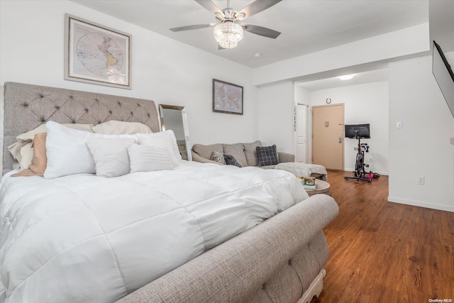 bedroom with dark hardwood / wood-style floors and ceiling fan