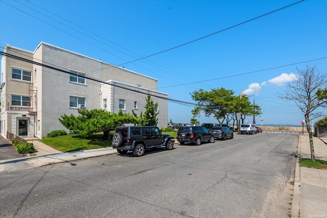 525 Bch 138th St Unit A2, Belle Harbor, NY 11694 - view of asphalt road with curbs, sidewalks, and street lights