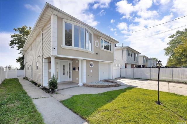 townhome / multi-family property with a front yard and a garage