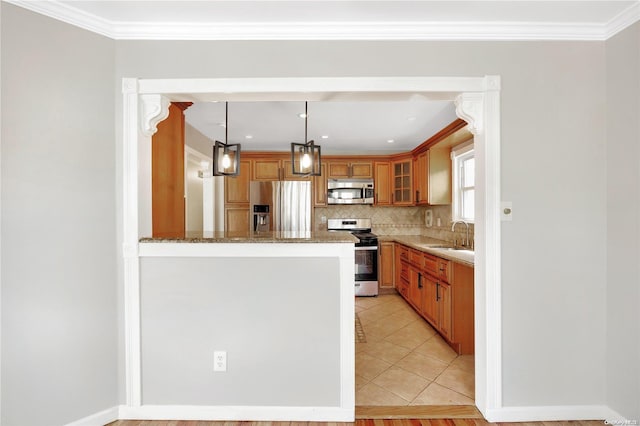 kitchen featuring decorative backsplash, appliances with stainless steel finishes, light stone counters, crown molding, and decorative light fixtures