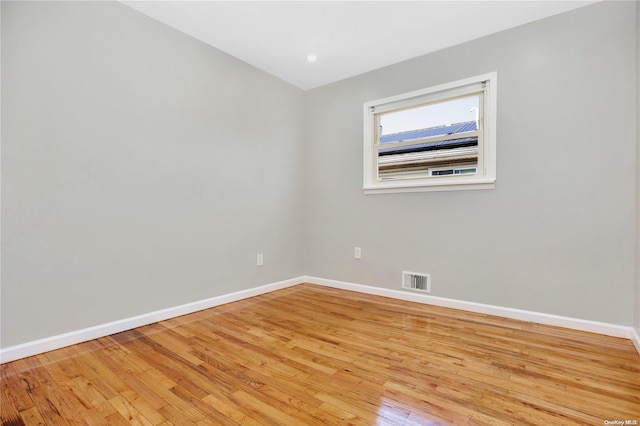 spare room featuring light wood-type flooring