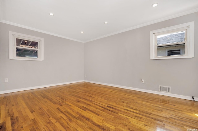 spare room with light hardwood / wood-style flooring and ornamental molding