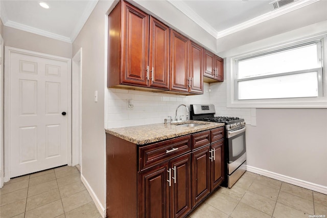 kitchen featuring crown molding, light stone countertops, sink, and stainless steel range with gas stovetop