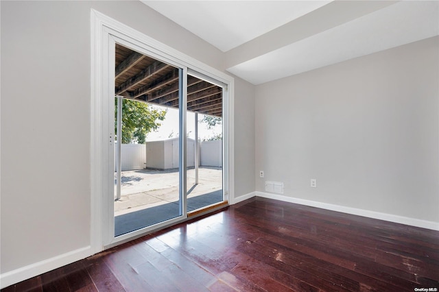 empty room featuring dark hardwood / wood-style floors