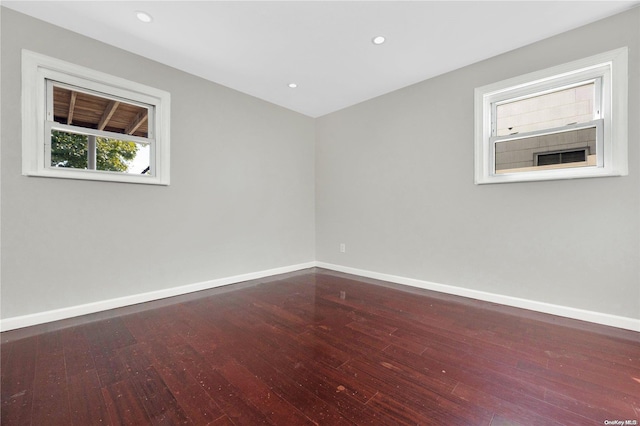 empty room with hardwood / wood-style flooring