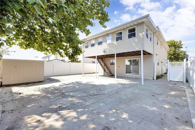 rear view of property featuring a patio