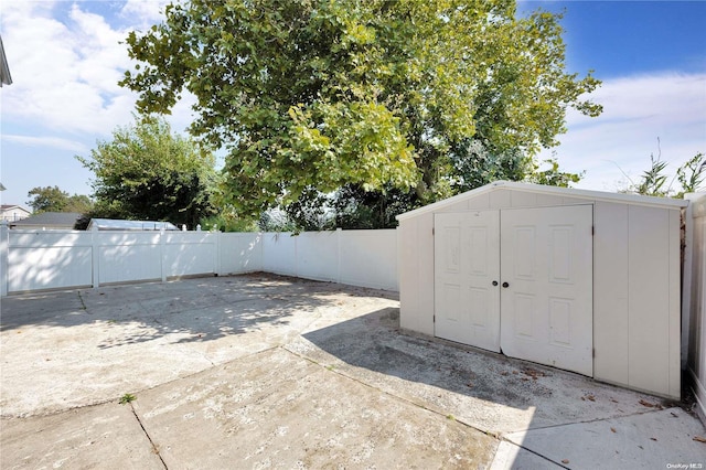 view of patio with a shed