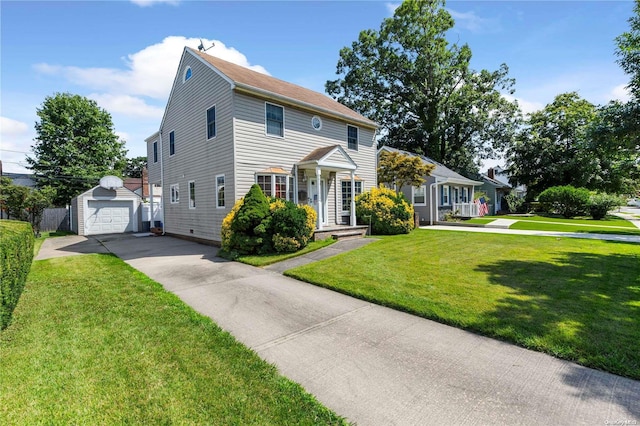 colonial house featuring a garage, an outbuilding, and a front lawn