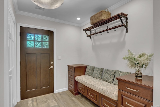 mudroom with light wood-type flooring, visible vents, and ornamental molding