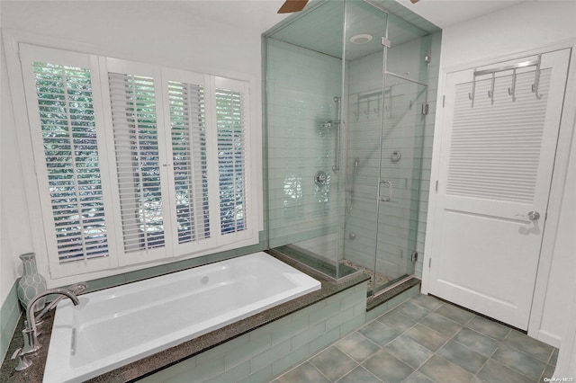 full bath with tile patterned floors, ceiling fan, a shower stall, and a bath