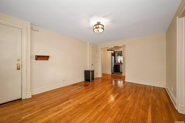 spare room with light hardwood / wood-style flooring