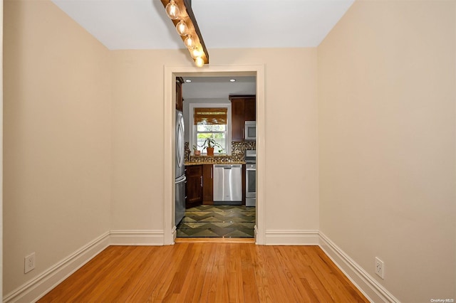 hall with light hardwood / wood-style flooring