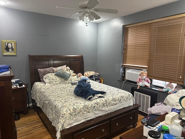 bedroom featuring ceiling fan and hardwood / wood-style floors