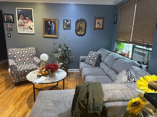 living room featuring hardwood / wood-style flooring and ornamental molding