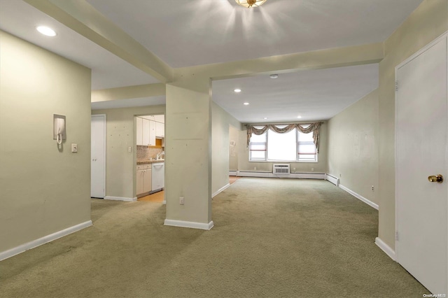 unfurnished living room featuring light colored carpet