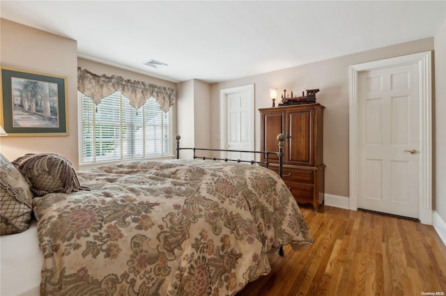 bedroom with light wood-type flooring