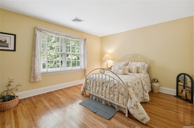 bedroom with light hardwood / wood-style floors