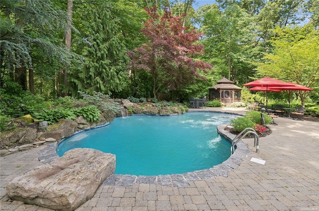 view of swimming pool featuring a gazebo and a patio area