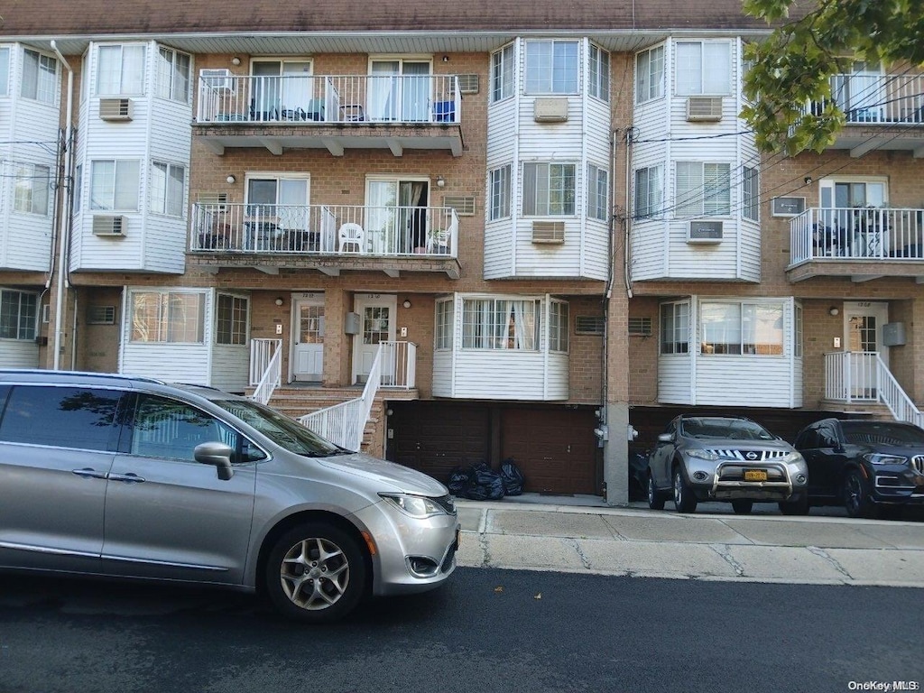 view of property with a wall mounted air conditioner