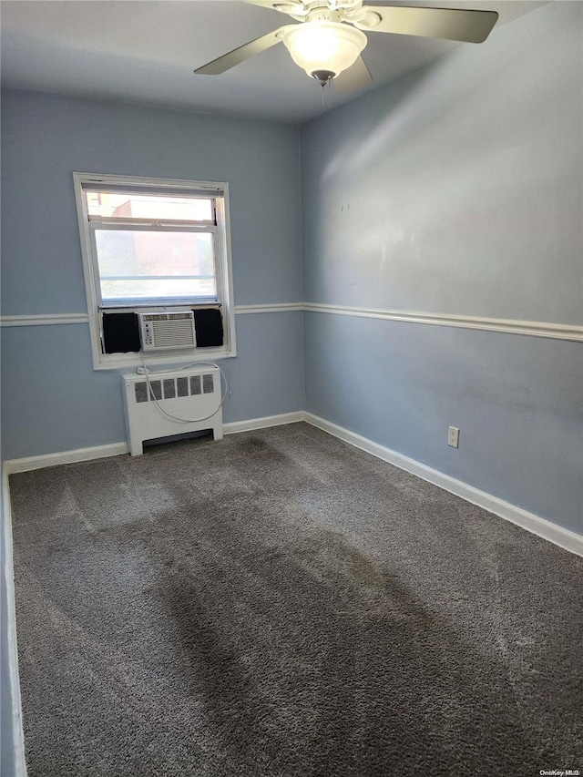 carpeted spare room with ceiling fan, radiator heating unit, and cooling unit