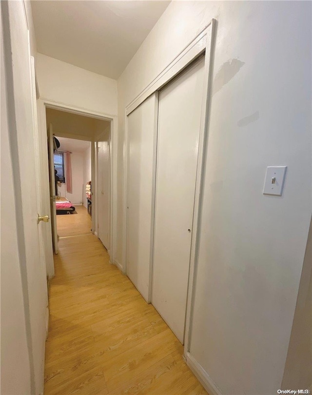 corridor featuring light hardwood / wood-style flooring