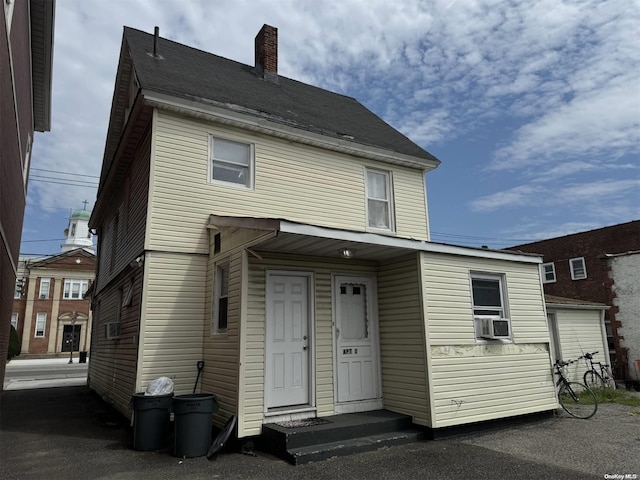 view of front facade with cooling unit