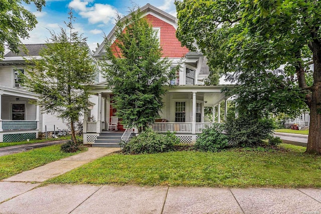 obstructed view of property featuring covered porch