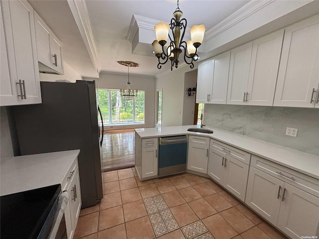 kitchen featuring kitchen peninsula, appliances with stainless steel finishes, white cabinetry, and pendant lighting