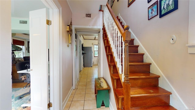 stairs featuring tile patterned floors