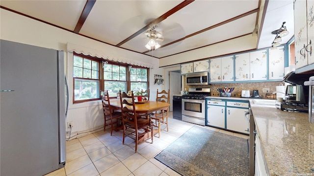 kitchen featuring white cabinetry, stainless steel appliances, tasteful backsplash, ceiling fan, and light stone counters