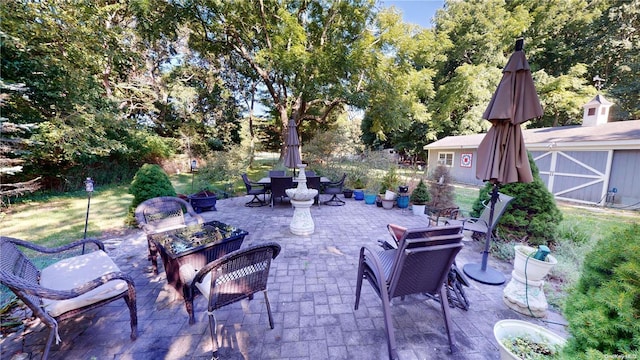 view of patio / terrace with an outdoor structure