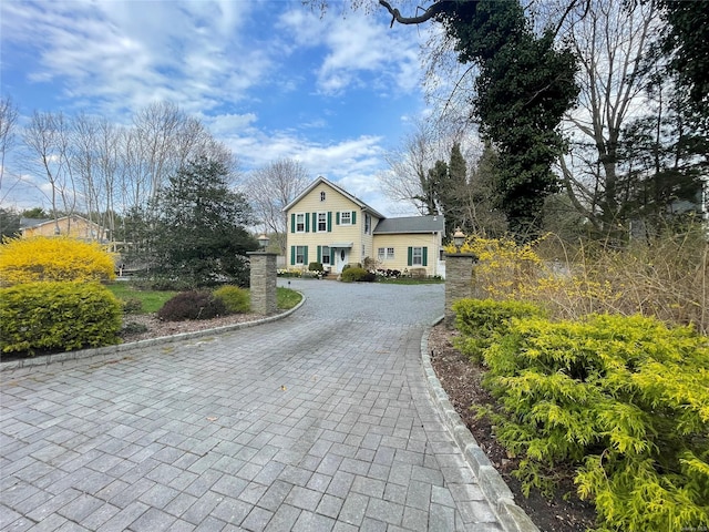 view of front of home featuring decorative driveway