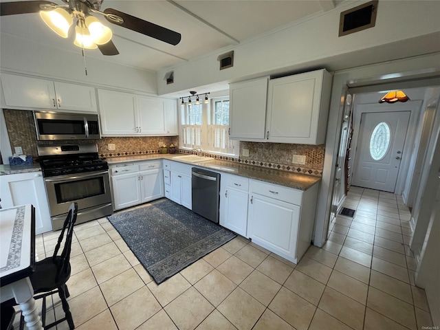 kitchen with white cabinets, visible vents, ceiling fan, stainless steel appliances, and a sink