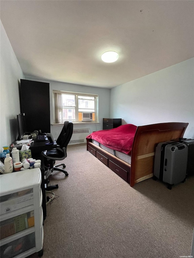 bedroom featuring radiator heating unit and carpet floors