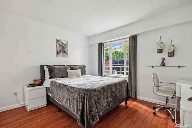 bedroom featuring dark hardwood / wood-style flooring