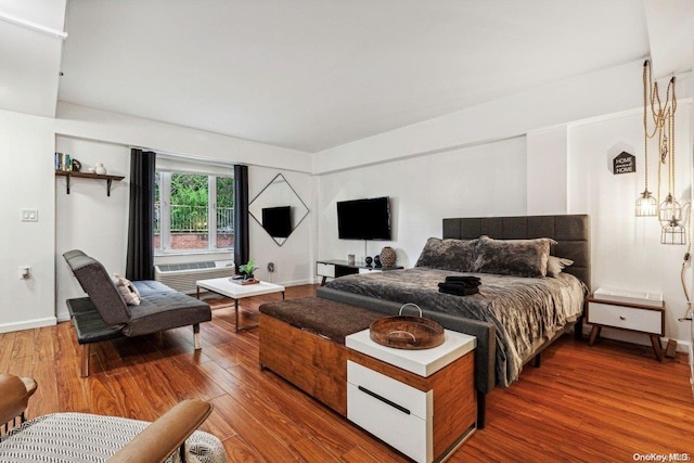 bedroom with hardwood / wood-style floors