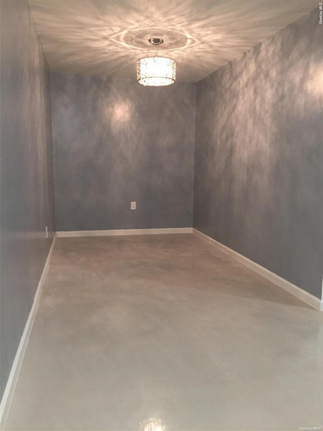 spare room featuring concrete floors