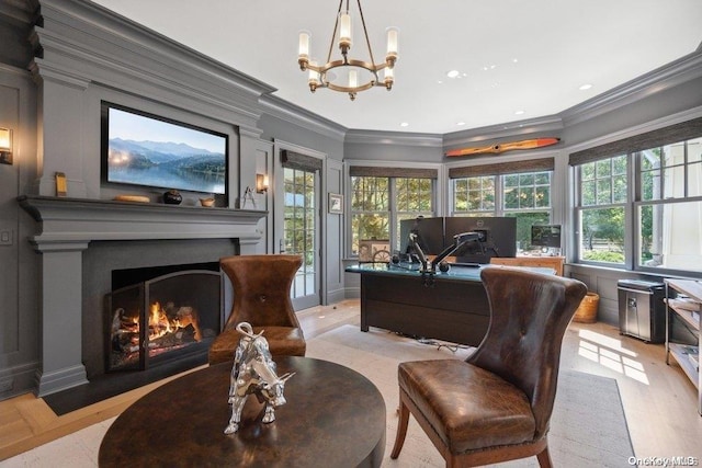 sitting room with crown molding, light hardwood / wood-style flooring, and a chandelier