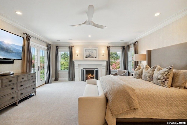 bedroom with french doors, ornamental molding, access to outside, light colored carpet, and ceiling fan