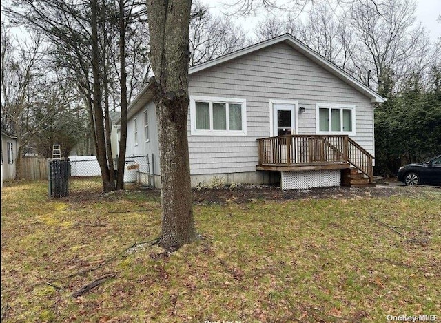 rear view of house with a lawn