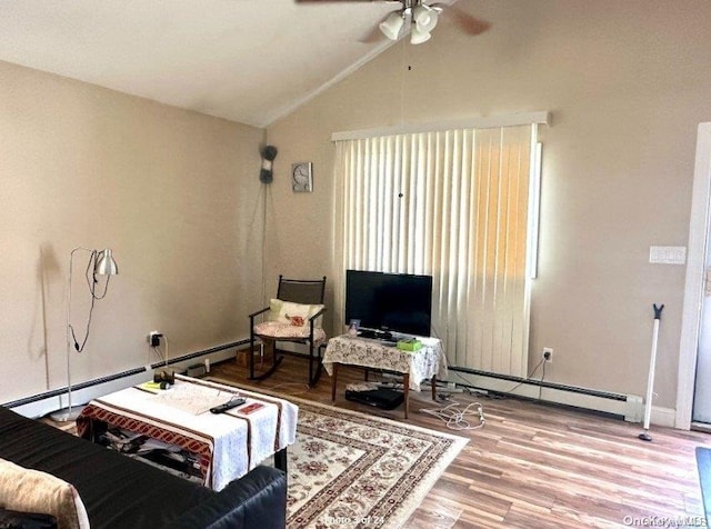 living room featuring ceiling fan, hardwood / wood-style floors, a baseboard radiator, and vaulted ceiling