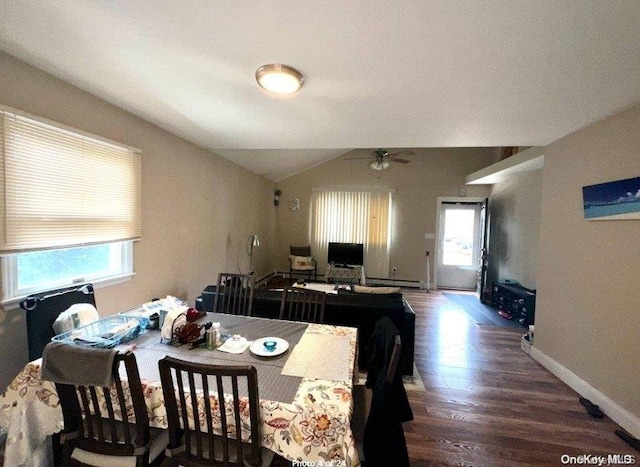 dining room featuring ceiling fan, hardwood / wood-style floors, and lofted ceiling